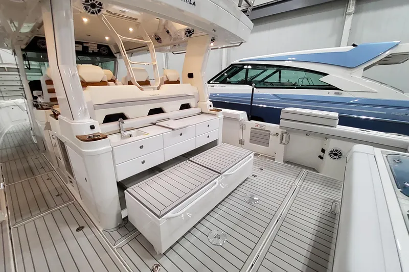 Slide: The Image of 2026 Formula 457 Center Console Fish boat interior with seating and storage. - 35