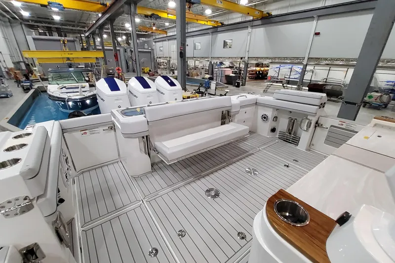 Slide: The Image of 2026 Formula 457 Center Console Fish boat interior in a manufacturing facility. - 39