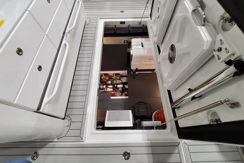 Slide: The Image of 2026 Formula 457 Center Console Fish boat interior with open storage compartment. - 43