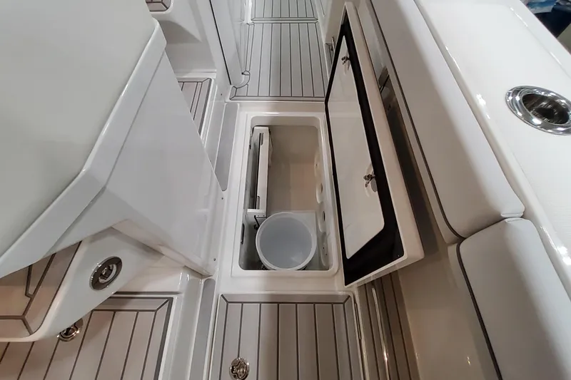 Slide: The Image of 2026 Formula 457 Center Console Fish boat interior with open storage compartment. - 56