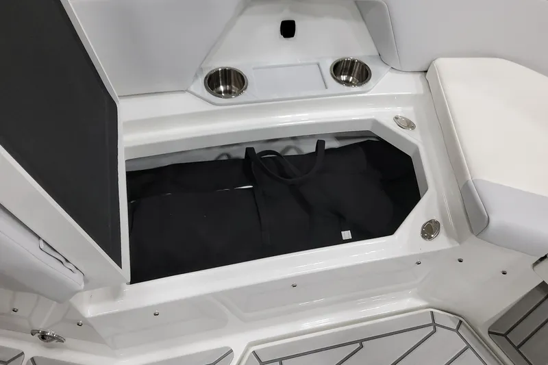 Slide: The Image of 2026 Formula 457 Center Console Fish boat storage compartment with cup holders and seating. - 62