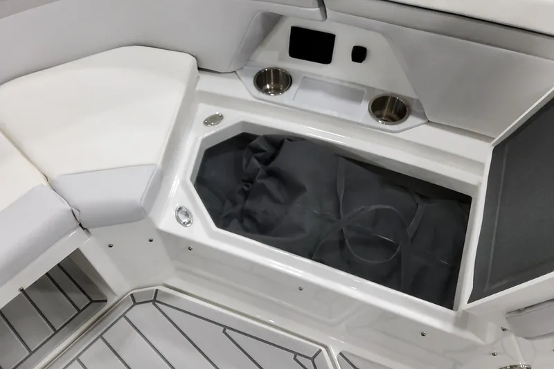 Slide: The Image of 2026 Formula 457 Center Console Fish boat interior with storage compartment and cup holders. - 63