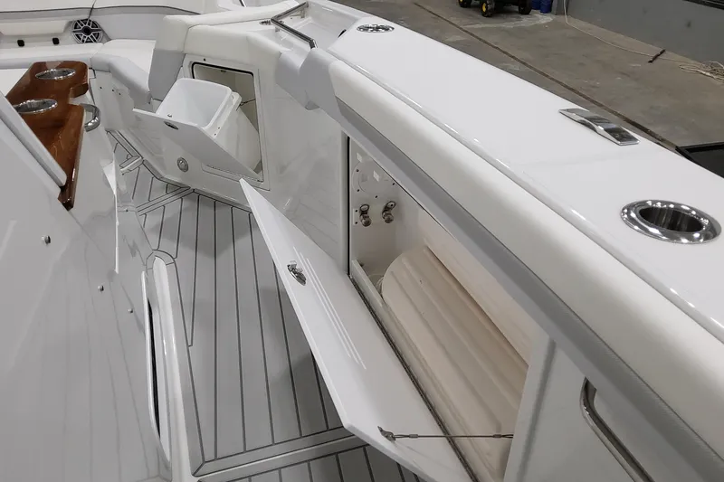 Slide: The Image of 2026 Formula 457 Center Console Fish boat interior with open storage compartments. - 65