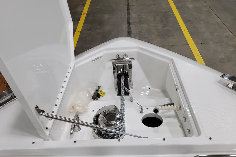 Slide: The Image of 2026 Formula 457 Center Console Fish boat anchor compartment with chain and winch. - 66