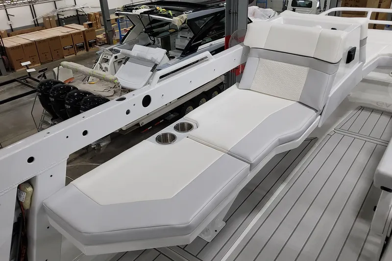 Slide: The Image of 2026 Formula 457 Center Console Fish boat interior with white seating and cup holders. - 72