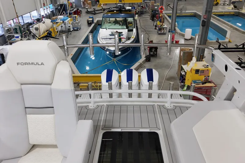 Slide: The Image of 2026 Formula 457 Center Console Fish boat in a manufacturing facility. - 73