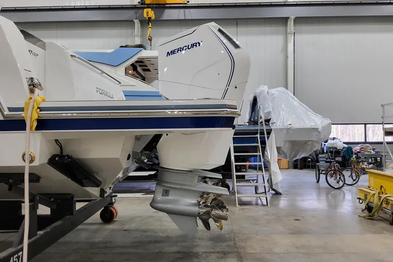 Slide: The Image of 2026 Formula 457 Center Console Fish boat in a workshop with Mercury engine. - 76