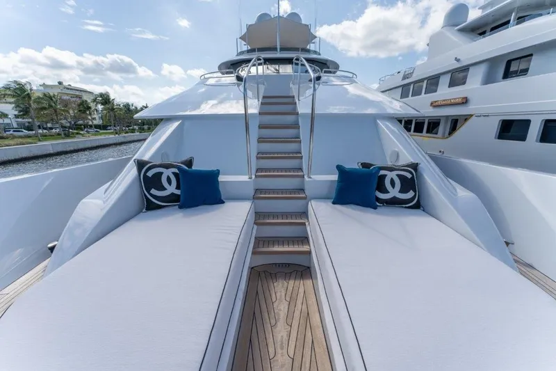 Slide: The Image of Luxurious 2006 Westport 130 Motoryacht deck with elegant seating and stylish cushions. - 13