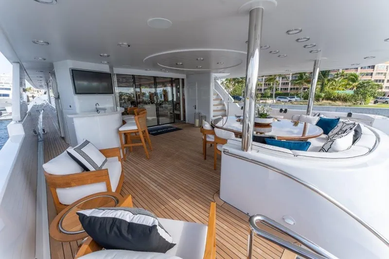 Slide: The Image of Luxurious 2006 Westport 130 Motoryacht deck with elegant seating and modern amenities. - 15
