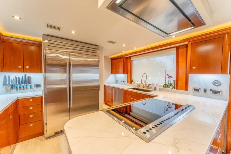 Slide: The Image of Luxurious kitchen in 2006 Westport 130 Motoryacht with stainless steel appliances and marble countertops. - 29