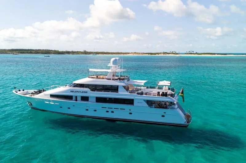Slide: The Image of Luxurious 2006 Westport 130 Motoryacht cruising in turquoise waters under a clear sky. - 3
