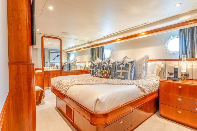 Slide: The Image of Luxurious bedroom interior on 2006 Westport 130 Motoryacht, featuring elegant wood finishes and plush bedding. - 39