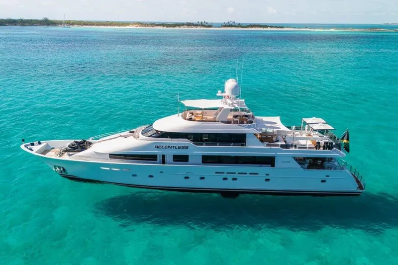 Slide: The Image of 2006 Westport 130 Motoryacht on turquoise waters, showcasing luxury and elegance. - 4