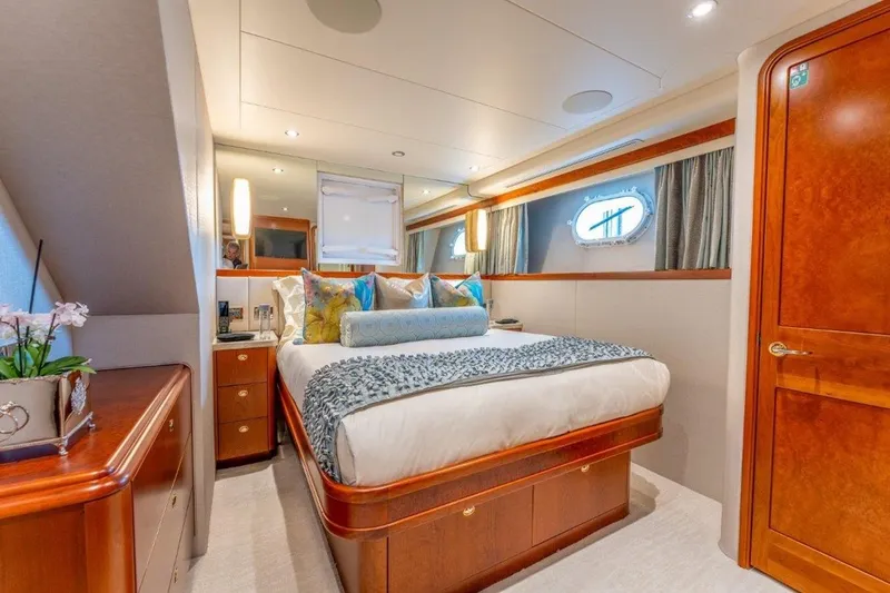 Slide: The Image of Luxurious bedroom interior of 2006 Westport 130 Motoryacht with elegant wood finishes. - 43