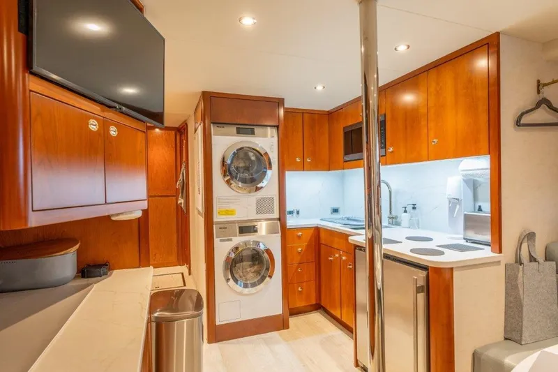 Slide: The Image of Luxurious 2006 Westport 130 Motoryacht interior with modern kitchen and laundry facilities. - 46