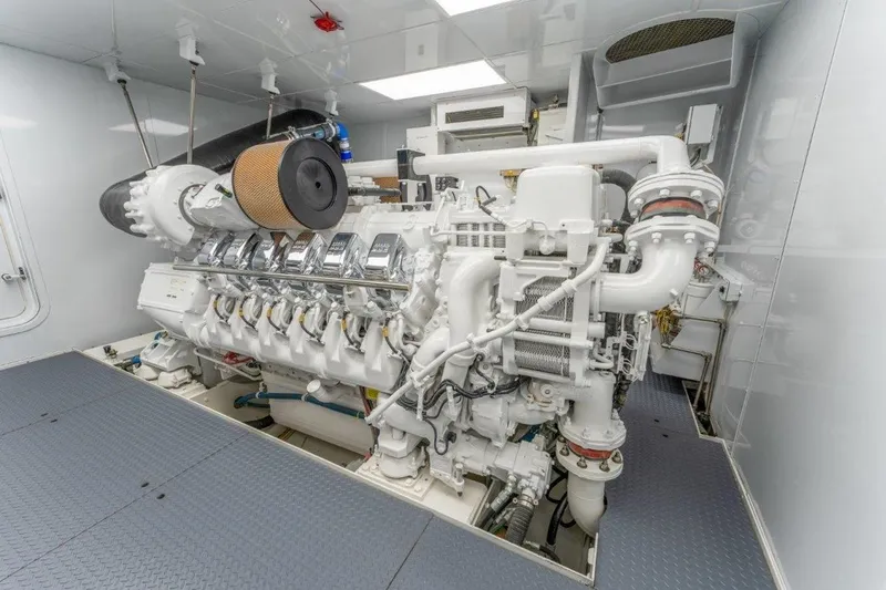 Slide: The Image of Engine room of 2006 Westport 130 Motoryacht, showcasing a powerful marine engine. - 50
