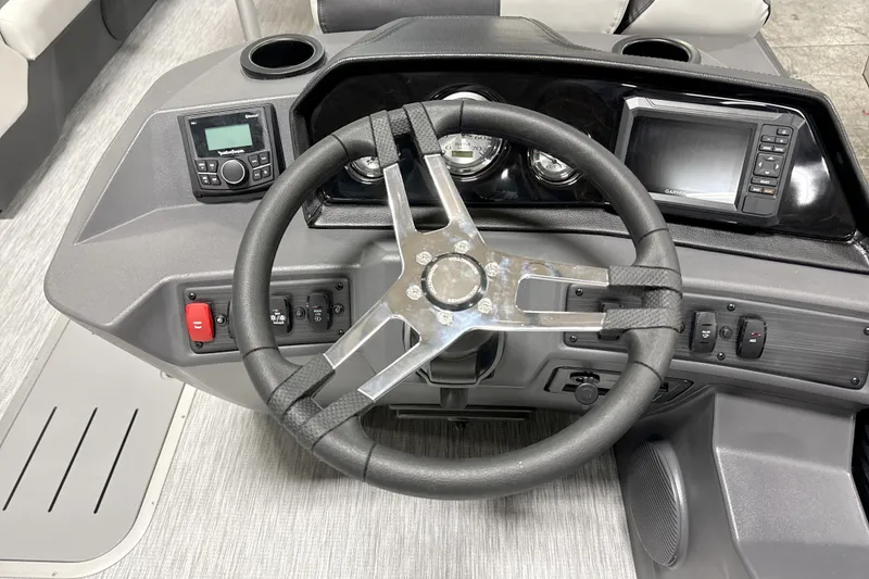 Slide: The Image of 2026 Bennington 22 S1 Swingback dashboard with steering wheel and navigation controls. - 10