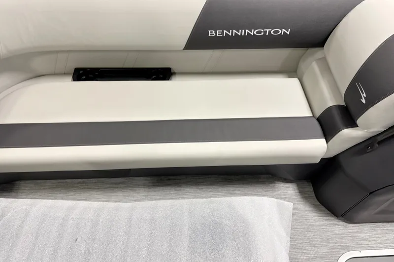 Slide: The Image of 2026 Bennington 22 S1 Swingback boat seat, featuring sleek gray and white upholstery. - 8