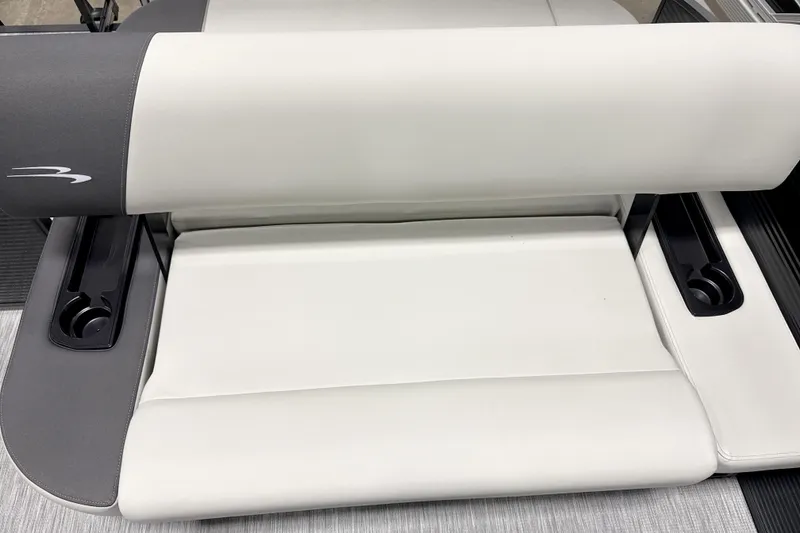 Slide: The Image of 2026 Bennington 22 S1 Swingback boat seat with cup holders, featuring sleek white and gray design. - 9