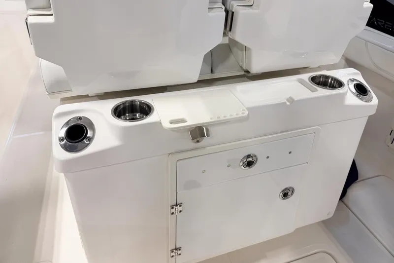 Slide: The Image of 2023 Pursuit S 268 Sport boat console with cup holders and storage compartment. - 5