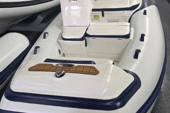 Slide: The Image of 2025 Walker Bay Generation 12 LTE inflatable boat interior with seating and storage compartments. - 3
