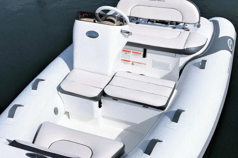 Slide: The Image of 2025 Walker Bay Generation 12 LTE inflatable boat with sleek white seating and modern design. - 7