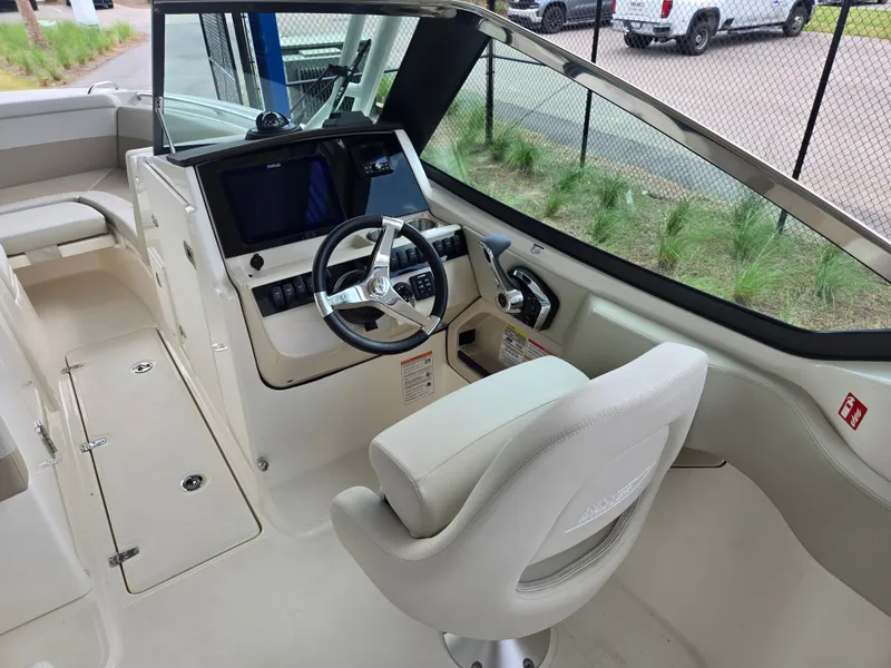 Slide: The Image of Interior of 2026 Boston Whaler 240 Vantage with helm console. - 12