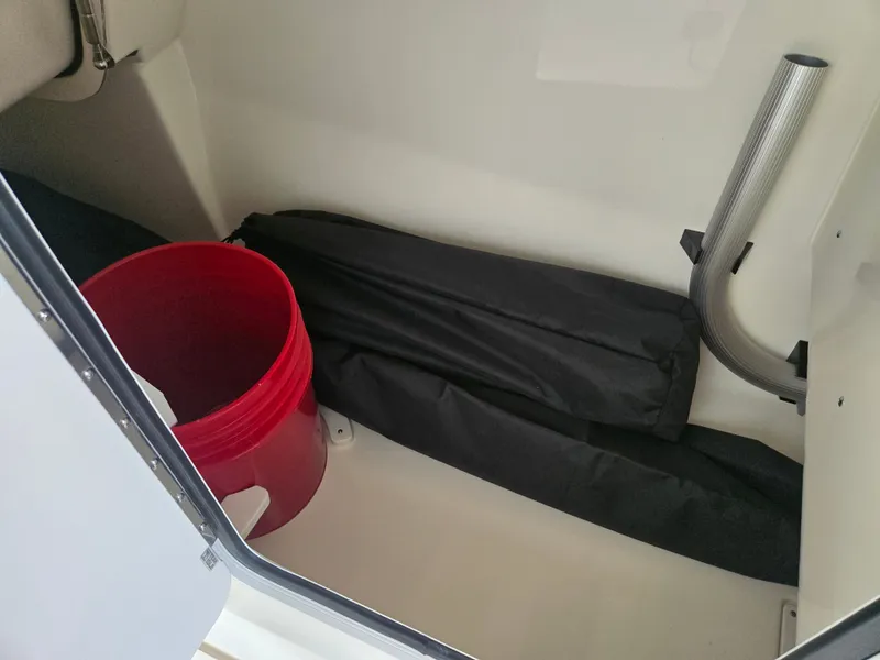 Slide: The Image of Interior of 2026 Boston Whaler 240 Vantage with red bucket. - 17