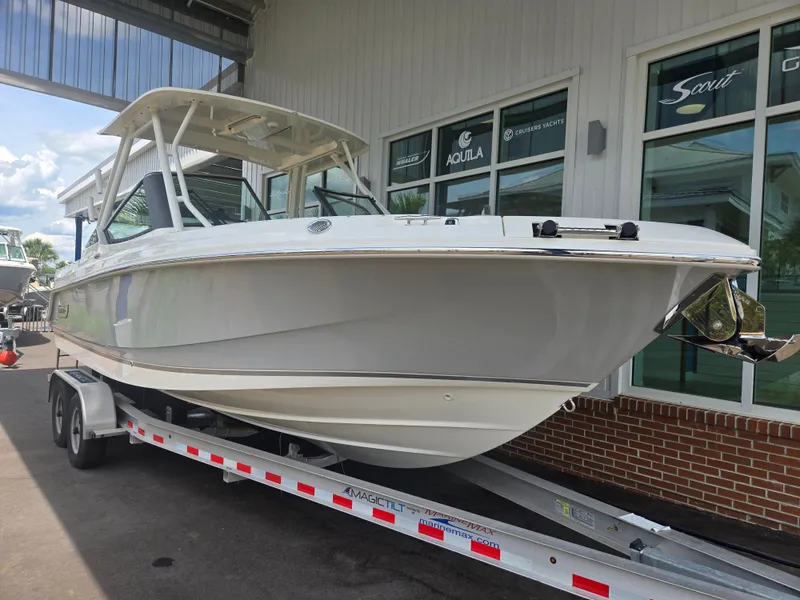 Slide: The Image of 2026 Boston Whaler 240 Vantage on trailer outside a building. - 23