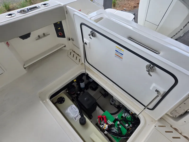 Slide: The Image of Interior view of Boston Whaler 240 Vantage 2026 boat engine compartment. - 5