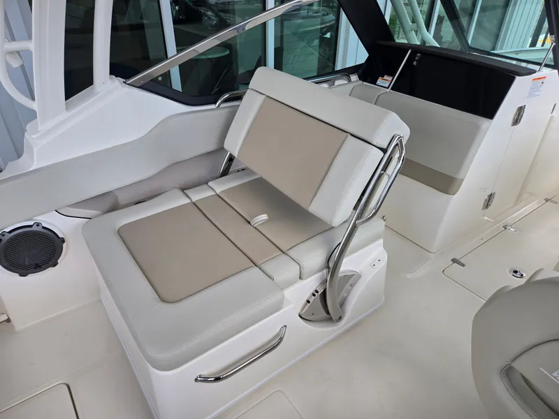 Slide: The Image of Interior of 2026 Boston Whaler 240 Vantage with beige seating. - 6