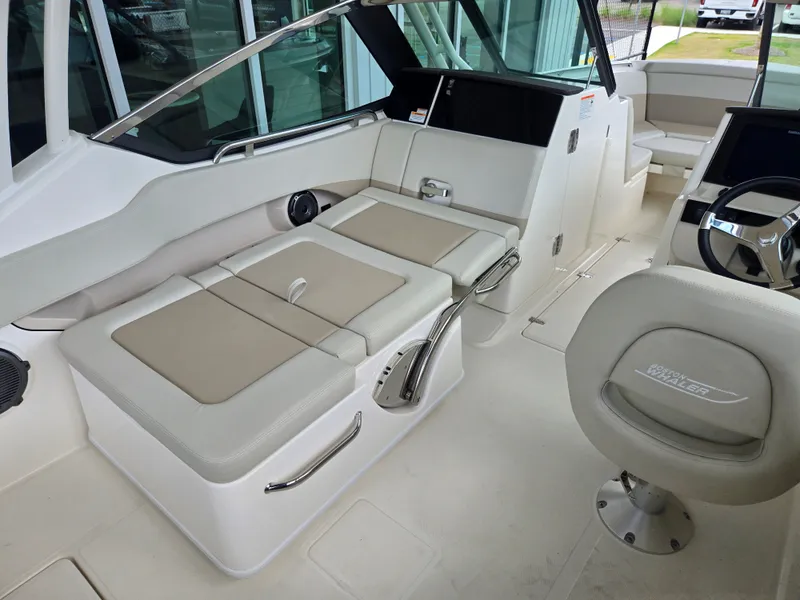 Slide: The Image of Interior of 2026 Boston Whaler 240 Vantage with beige seating. - 7