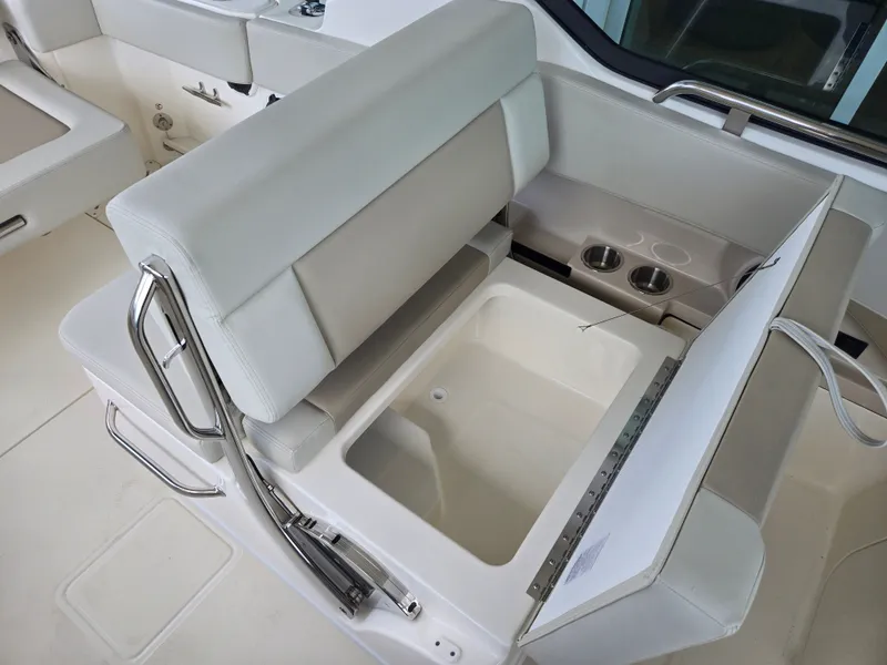 Slide: The Image of Interior of 2026 Boston Whaler 240 Vantage with seating and storage. - 9