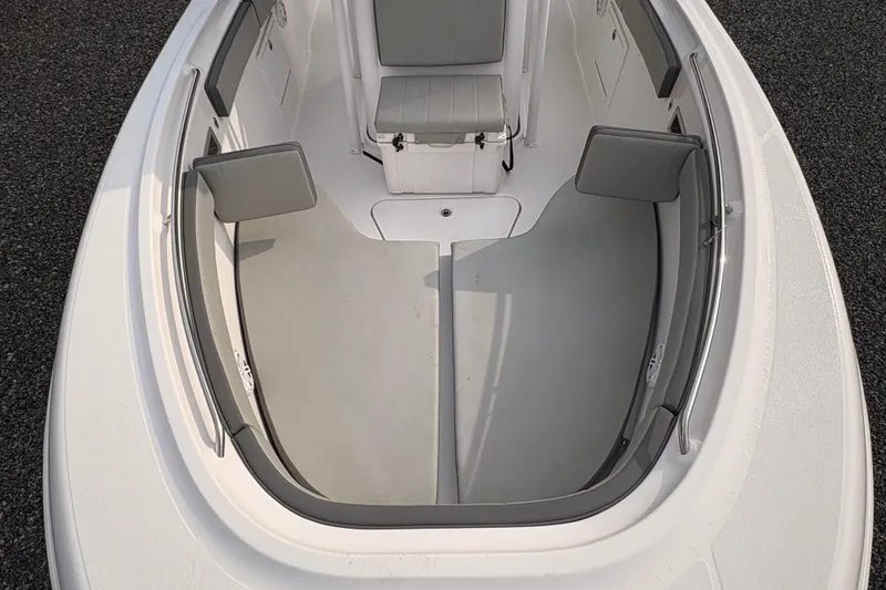 Slide: The Image of 2022 Aquasport 2500 Center Console boat interior with seating and storage compartments. - 17