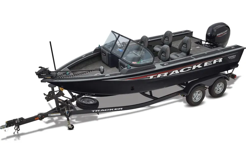 Slide: The Image of 2026 Tracker Targa V-18 WT boat interior with carpeted deck and storage compartments. - 8