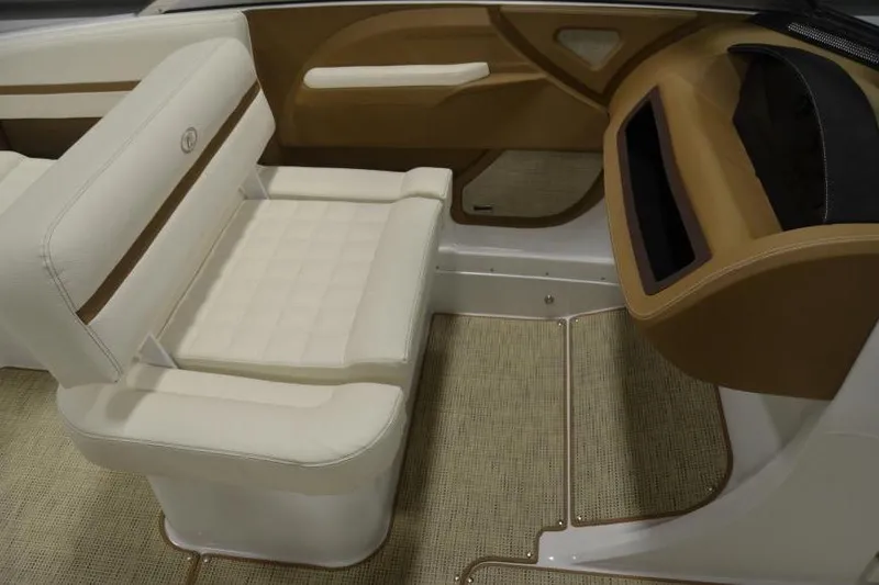 Slide: The Image of 2018 Cobalt R3 boat interior with beige and white seating, elegant design. - 11