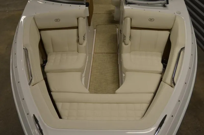 Slide: The Image of 2018 Cobalt R3 boat interior with beige seating and carpeted floor. - 14