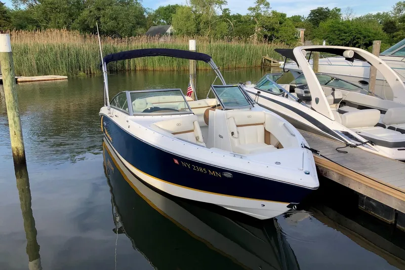 Slide: The Image of 2018 Cobalt R3 boat docked in a serene marina setting. - 3