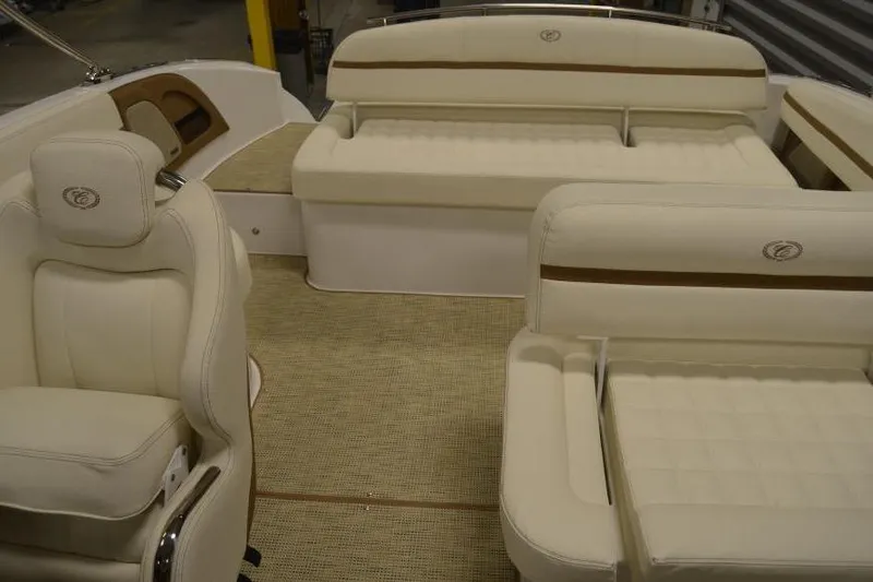 Slide: The Image of 2018 Cobalt R3 boat interior with beige leather seating and carpeted flooring. - 9