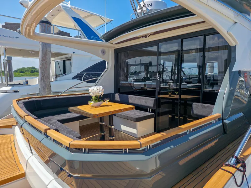 Slide: The Image of Luxury Marex 440 yacht, 2026 model, featuring elegant outdoor seating and dining area. - 15