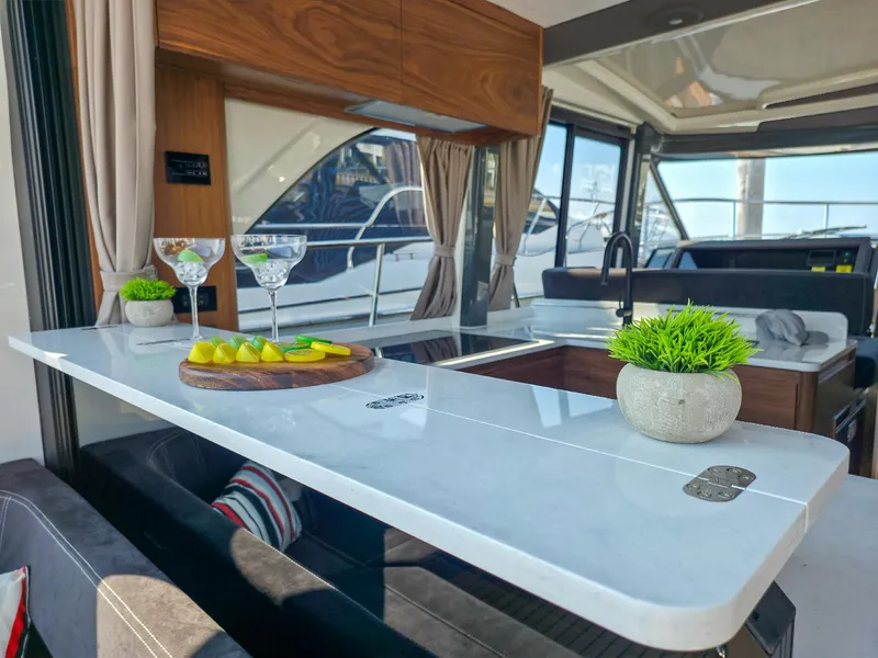 Slide: The Image of Luxurious interior of 2026 Marex 440 yacht with elegant bar setup and modern decor. - 44