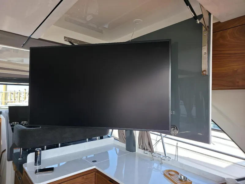 Slide: The Image of Modern interior of 2026 Marex 440 yacht with mounted flat-screen TV. - 45