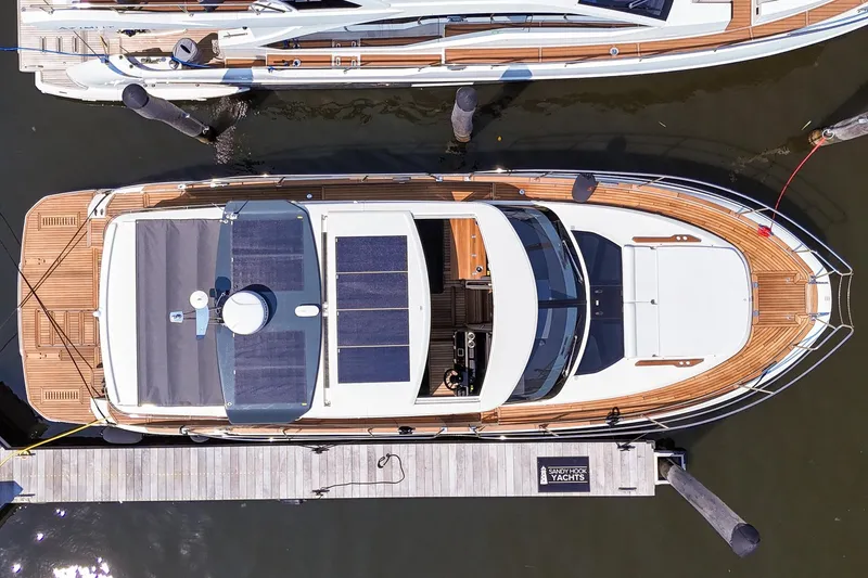 Slide: The Image of Top view of 2026 Marex 440 yacht docked at a marina. - 7