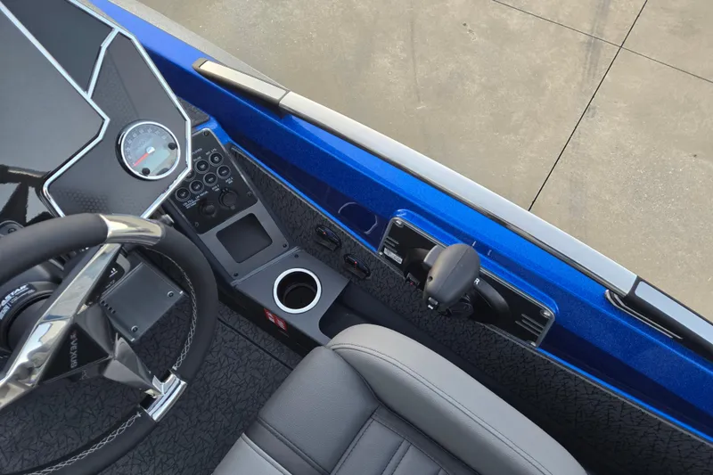 Slide: The Image of 2026 Vexus VXs20 boat cockpit with steering wheel, controls, and blue interior. - 5