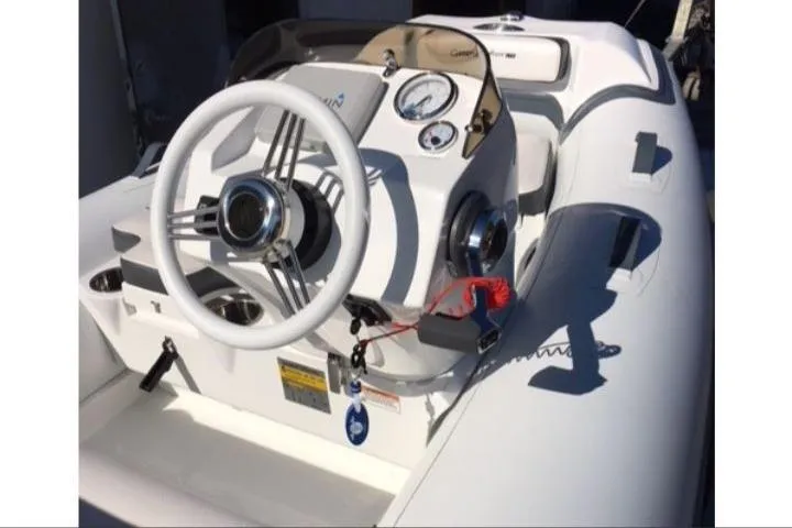 Slide: The Image of 2025 Walker Bay Generation 11 LTE boat with Tohatsu 30HP engine, featuring sleek steering console. - 7