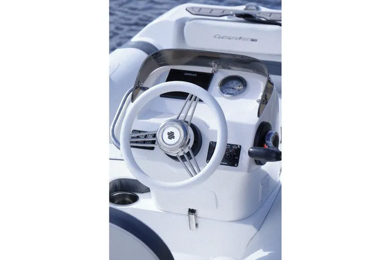 Slide: The Image of Steering console of 2025 Walker Bay Generation 11 LTE boat, featuring modern controls. - 2