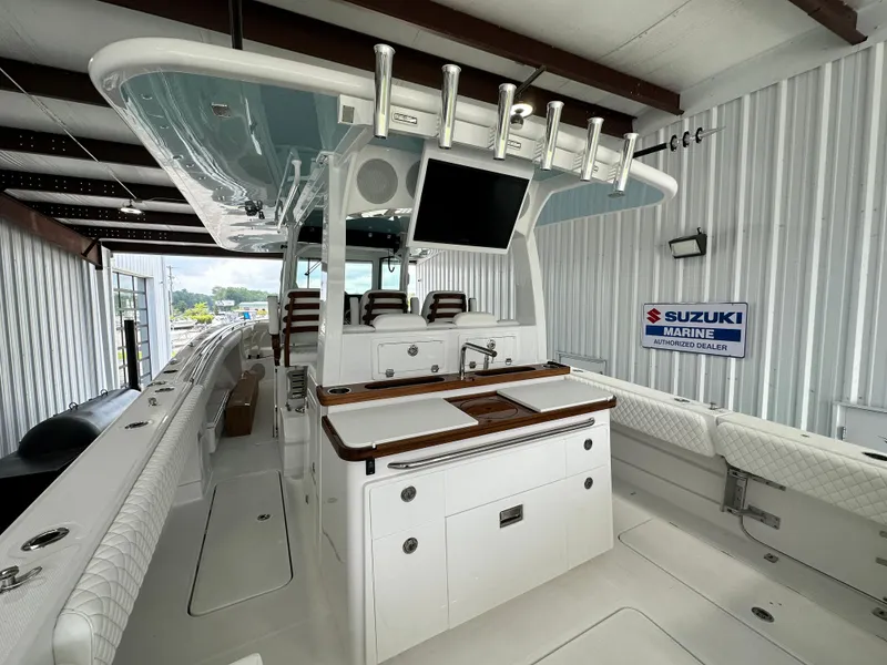 Slide: The Image of 2025 HCB Lujo boat interior with modern amenities in a storage facility. - 28