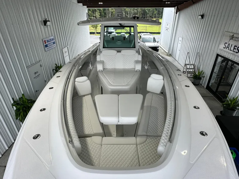 Slide: The Image of 2025 HCB Lujo luxury boat interior with white seating and modern design. - 30