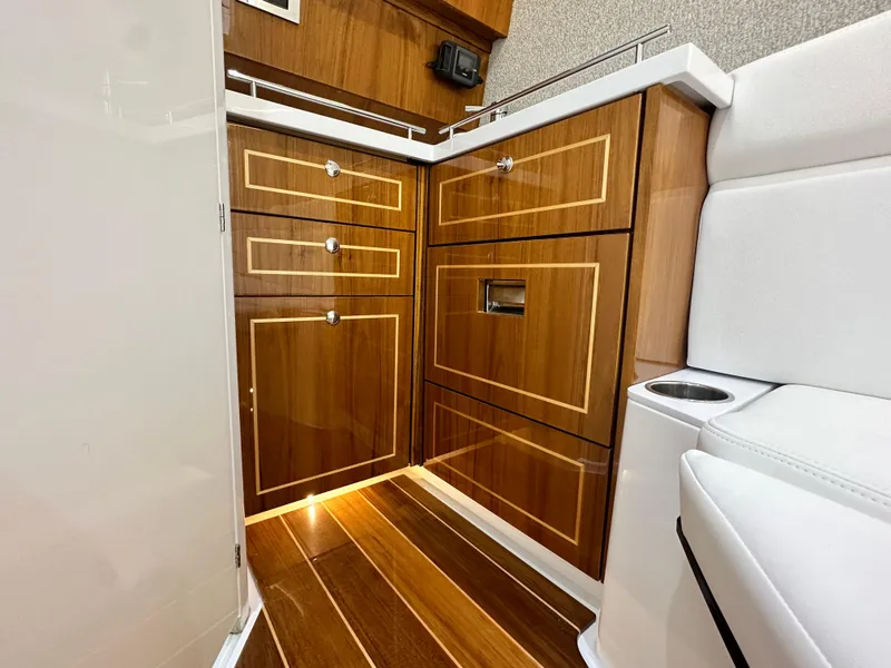 Slide: The Image of Luxurious 2025 HCB Lujo yacht interior with elegant wood cabinetry and flooring. - 33