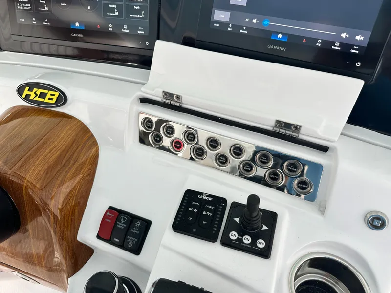 Slide: The Image of HCB Lujo 2025 boat dashboard with control panel and display screens. - 45